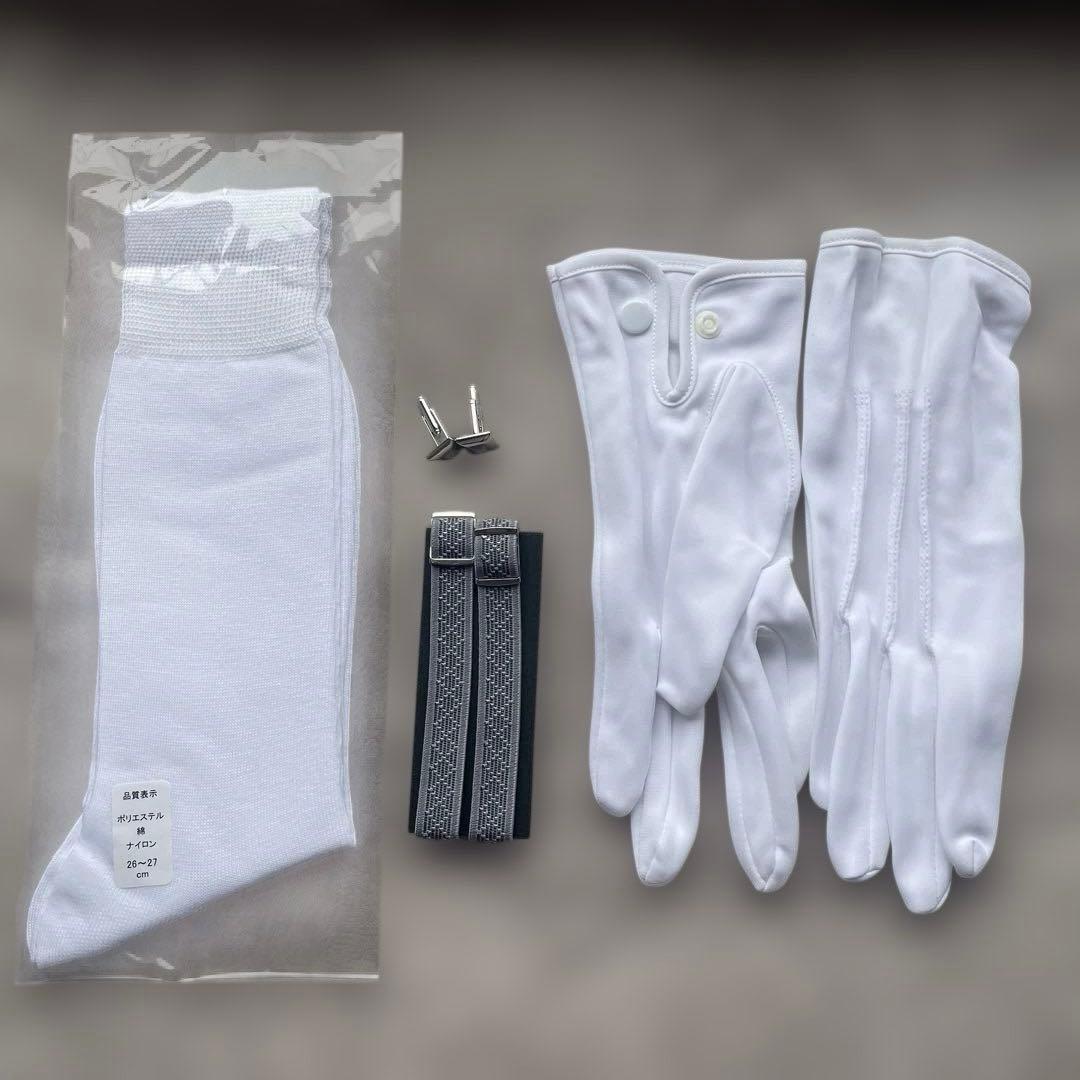 White gloves, socks, armbands, and cuffs