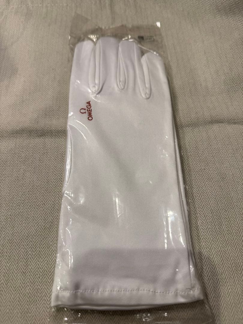 New, unopened Omega gloves with logo, size S. Super rare.