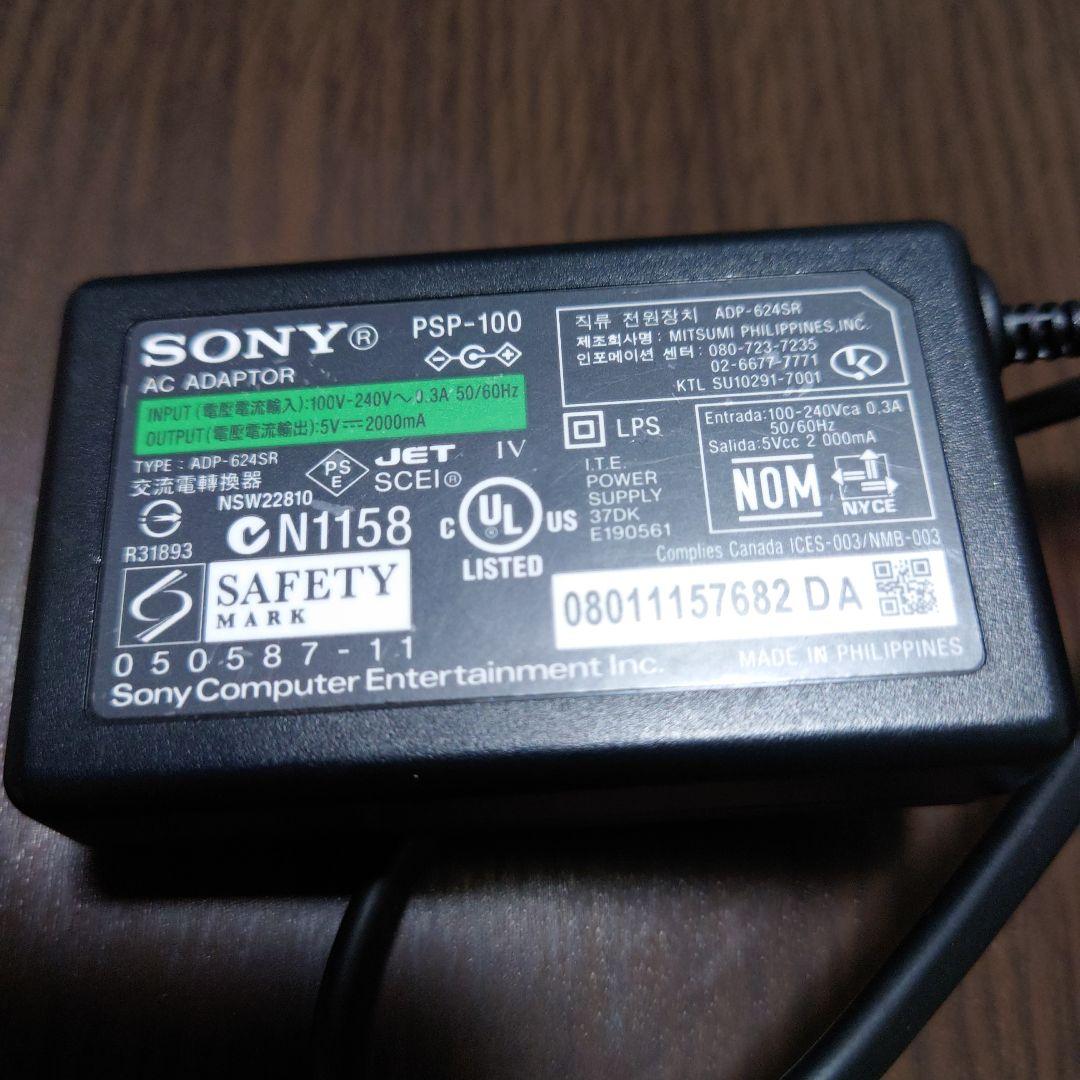 PSP2000 Console (Junk) + AC Adapter + Memory Stick + Game